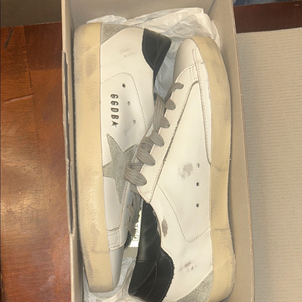 Women's Golden Goose Super-Star with black heel tab and metal stud lettering